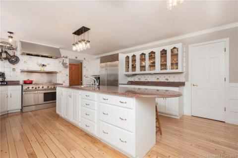 Living room which opens to the dining room and french doors leading to the balcony. Gorgeous lake views.