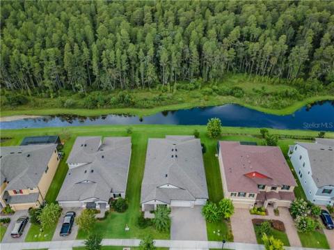 STUNNING gourmet kitchen with crown molding, quartz counter tops, custom stone backsplash, stainless steel appliances AND vented hood, GAS community!