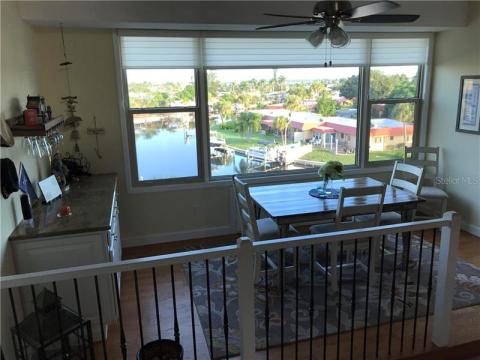 Fantastic dining room with wine bar, wine refrigerator and wine glass rack. Look at that view!!!
