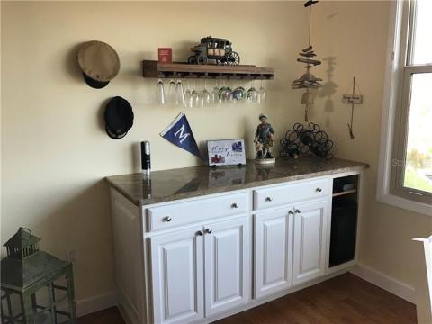 So much fun to entertain with a dry bar with wine refrigerator and wine rack.