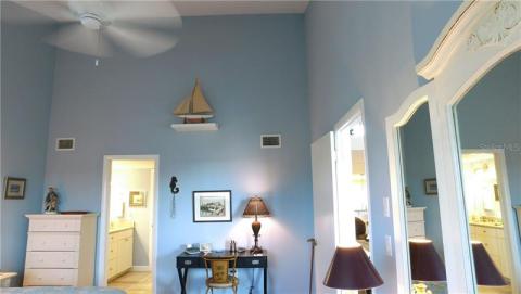 Huge master bedroom with roaring ceilings.