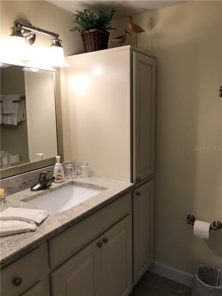 2nd bedroom sink with storage.