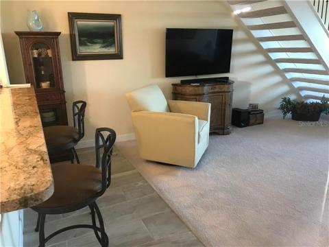 Living room area and eat-at bar