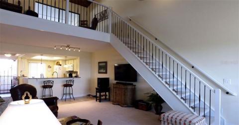 2nd part of living room. New staircase to second floor (used to be a spiral staircase.) 2nd floor office/den/sitting room on upper level.