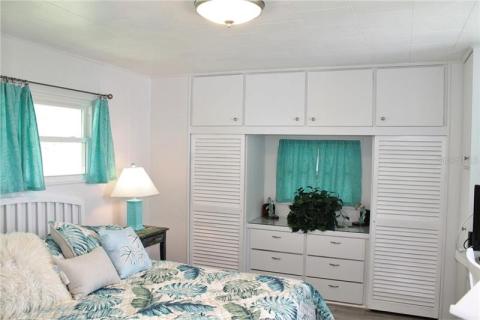 Master Bedroom with built-in dresser, closets and desk. Master Bedroom with built-in dresser, closets and desk.