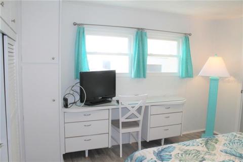 Master Bedroom with built-in dresser and closets with desk. Master Bedroom with built-in dresser and closets with desk.