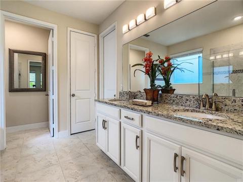 Height raised vanity with dual sinks and upgraded elegant led light fixtures