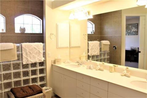 Master bath, two sinks, roman shower, private water closet