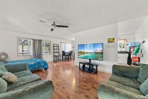 Front House Living room space with view of dining space area