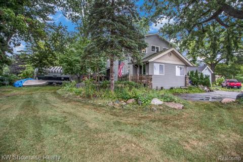 View of home's exterior featuring a lawn
