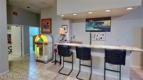 Downstairs-Game-Room-opens-out-to-covered-parking-area-and-garage.
