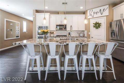 Gourmet kitchen with double ovens and back splash