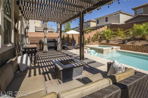 Large yard with pool, spa and covered patio.