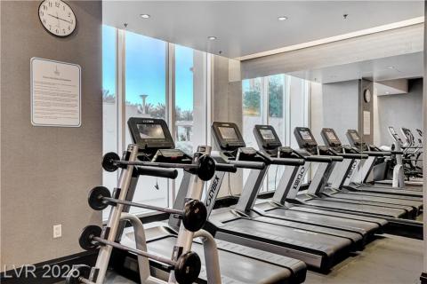 Workout area featuring a wall of windows Workout area featuring a wall of windows