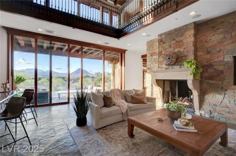 Living room with a wood ceiling with exposed beams, high vaulted ceiling, and carpet floors