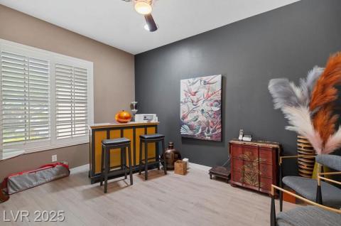 Office area featuring baseboards and light wood-type flooring