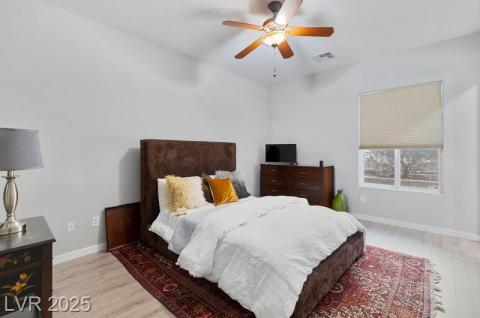 Bedroom featuring light wood finished floors and ceiling fan
