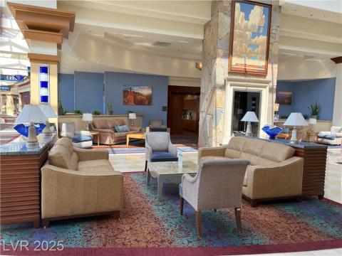 Common area featuring beam ceiling