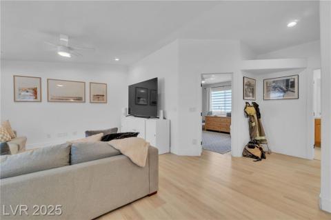 Upstairs Living area with light wood-style flooring, recessed lighting, and a ceiling fan