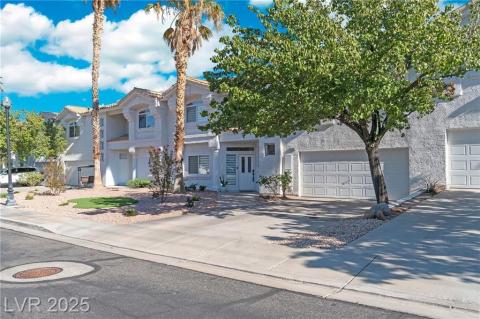 Mediterranean / spanish-style house featuring stucco siding, driveway, and a garage