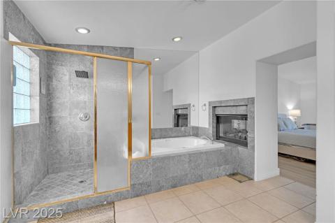 Ensuite bathroom with a shower stall, a bath, light tile patterned floors, and recessed lighting. You will love the giant size of this Ensuite!