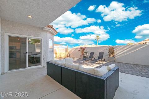 Fenced backyard featuring a patio