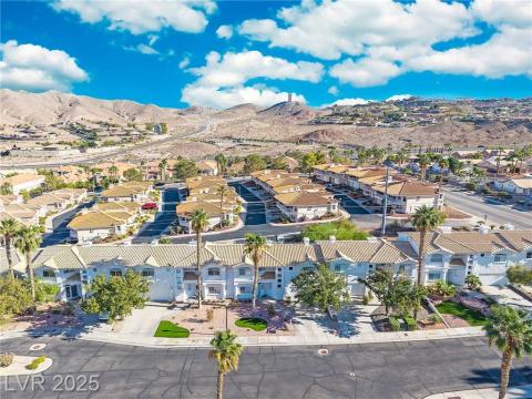 Aerial view of residential area with a mountain backdrop