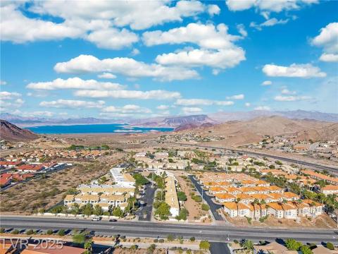 Aerial view of residential area with a water and mountain view