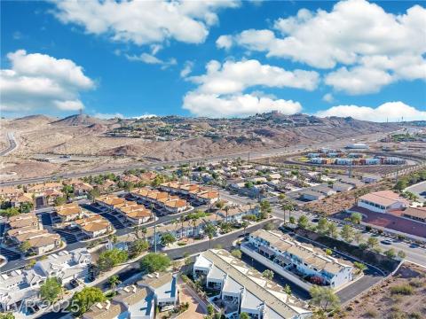 View of property location featuring nearby suburban area and mountains