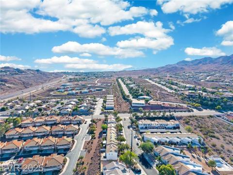 Aerial view of residential area featuring mountains