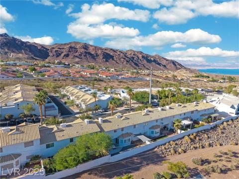 Aerial perspective of suburban area featuring a mountain backdrop