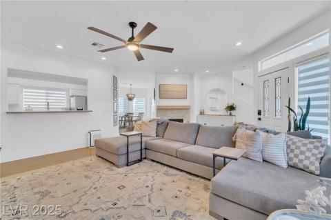 Living area with ceiling fan and recessed lighting