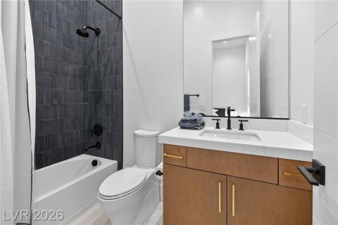 Full bathroom with vanity and shower/tub combo Full bathroom with vanity and shower/tub combo