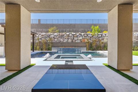 Relaxing pool/spa & water feature with a covered patio area. Relaxing pool/spa & water feature with a covered patio area.