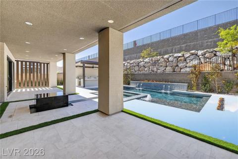 Integrated pool / spa featuring a patio area and a fenced backyard Integrated pool / spa featuring a patio area and a fenced backyard