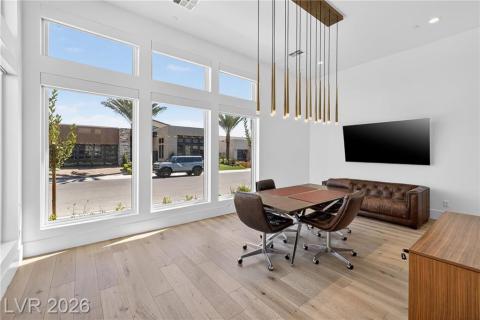 Foyer entrance with luxury wood floors and designer RH lighting fixture Foyer entrance with luxury wood floors and designer RH lighting fixture