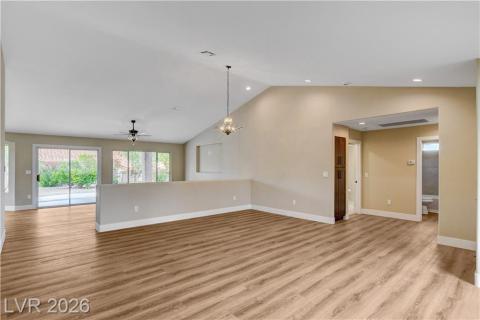 This airy living space features vaulted ceilings and abundant natural light, perfect for vibrant daily living. This airy living space features vaulted ceilings and abundant natural light, perfect for vibrant daily living.