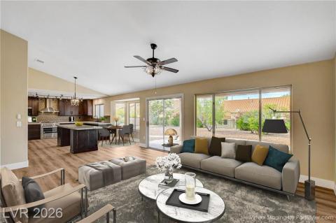 An open-concept family/kitchen area boasts vaulted ceilings and generous outdoor access, perfect for gatherings. An open-concept family/kitchen area boasts vaulted ceilings and generous outdoor access, perfect for gatherings.