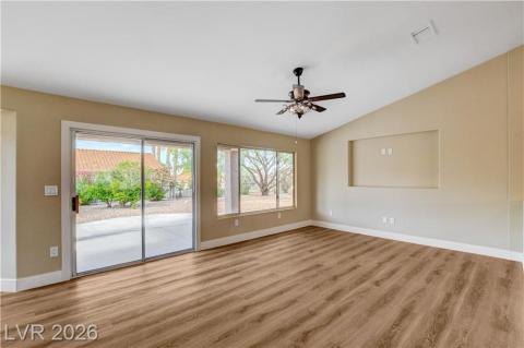 This bright living space features water proof plank flooring, vaulted ceilings, and ample natural light. This bright living space features water proof plank flooring, vaulted ceilings, and ample natural light.