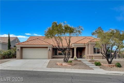 This desert-style home features a beautiful tile roof and an inviting front entrance. This desert-style home features a beautiful tile roof and an inviting front entrance.