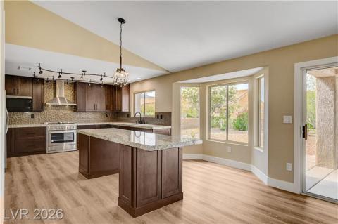 Modern kitchen with granite countertops and cabinetry provides an inviting culinary space. Modern kitchen with granite countertops and cabinetry provides an inviting culinary space.