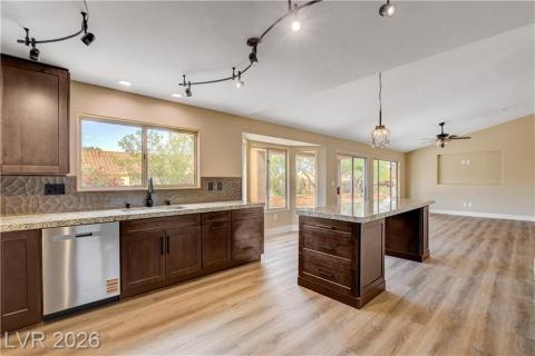 Bright and open, this kitchen flows into an inviting family room with views of the outdoors. Bright and open, this kitchen flows into an inviting family room with views of the outdoors.