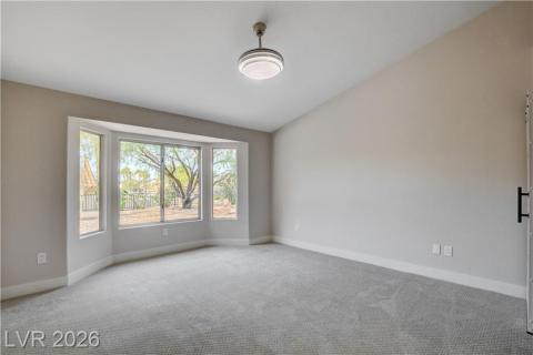This airy primary bedroom offers a serene retreat with expansive bay windows and vaulted ceilings. This airy primary bedroom offers a serene retreat with expansive bay windows and vaulted ceilings.