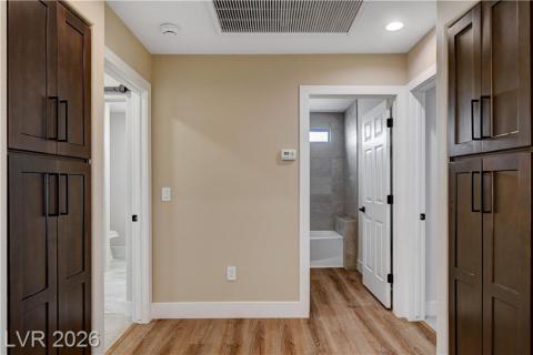 This spacious hallway connects private retreats, offering seamless flow and practical built-in storage solutions. This spacious hallway connects private retreats, offering seamless flow and practical built-in storage solutions.