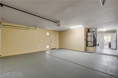 This spacious garage offers ample room for vehicles and storage, with durable flooring. This spacious garage offers ample room for vehicles and storage, with durable flooring.