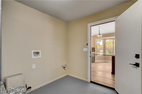 This dedicated laundry space offers convenience and direct access to adjacent living areas. This dedicated laundry space offers convenience and direct access to adjacent living areas.