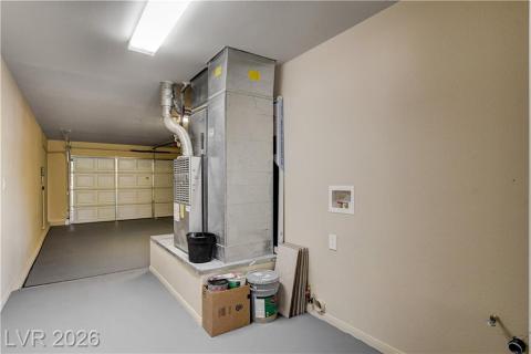 This spacious garage offers ample room for vehicles and storage, with dedicated laundry hookups for convenience. This spacious garage offers ample room for vehicles and storage, with dedicated laundry hookups for convenience.
