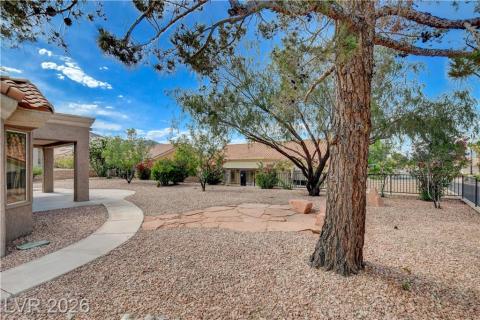 This tranquil yard features mature trees and a flagstone patio, perfect for outdoor enjoyment. This tranquil yard features mature trees and a flagstone patio, perfect for outdoor enjoyment.