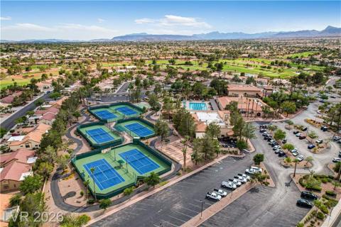 This aerial view showcases a vibrant community with recreational amenities and expansive landscapes. This aerial view showcases a vibrant community with recreational amenities and expansive landscapes.