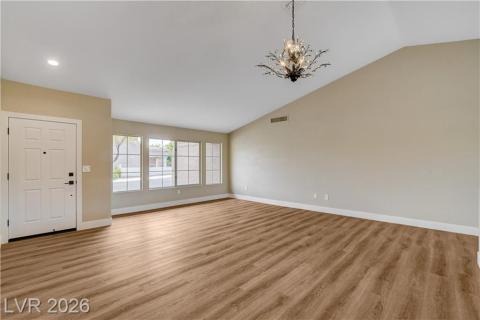 This expansive living space features striking vaulted ceilings and abundant natural light. This expansive living space features striking vaulted ceilings and abundant natural light.